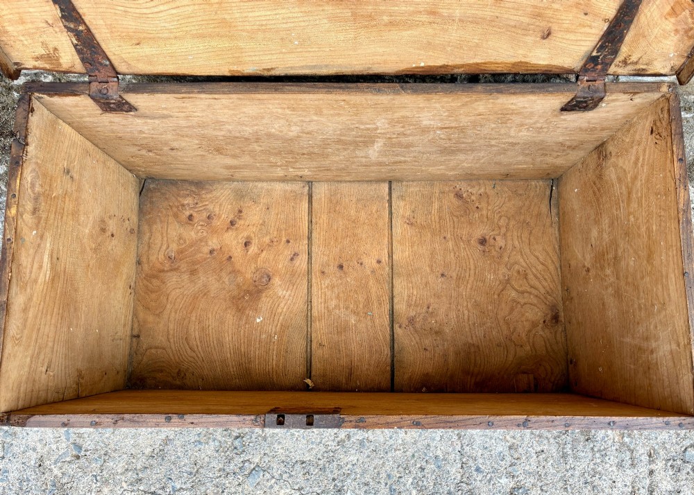 A rectangular antique elm blanket box featuring a hinged lid, visible wood grain, and a central keyhole escutcheon. View IV