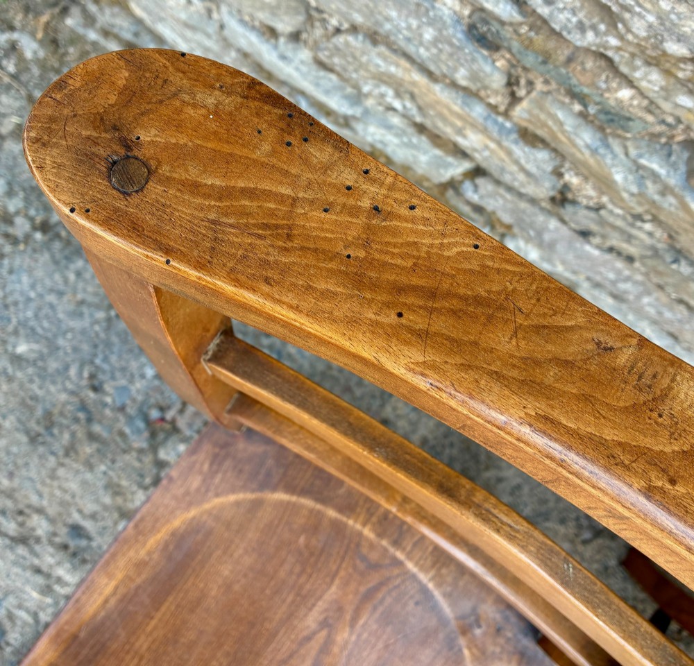 A set of four matching antique wooden chapel chairs with contoured seats and ladder-back rails. View XII
