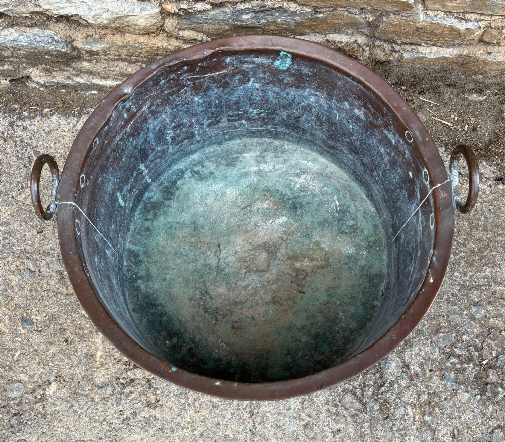 A large cylindrical antique copper wash tub featuring a flared rolled rim, side handles, and a heavily aged green verdigris patina. View III