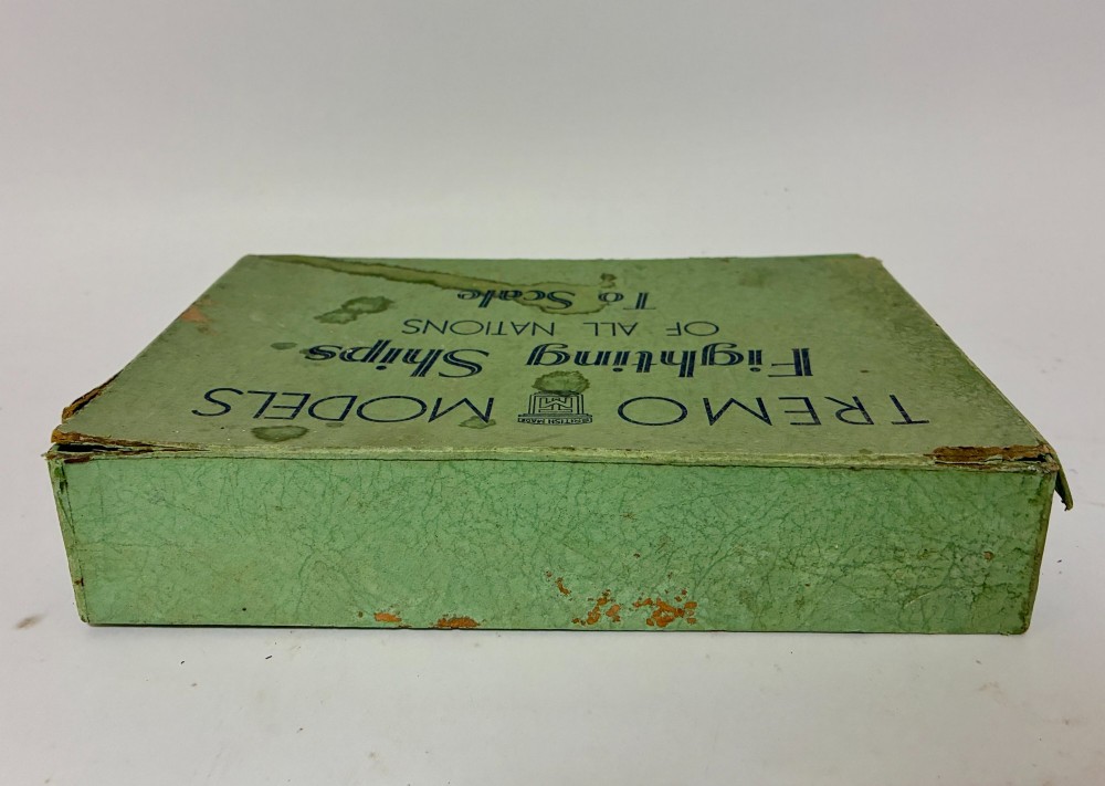 A vintage green cardboard box containing a set of miniature diecast metal model warships of the British Navy. View VIII