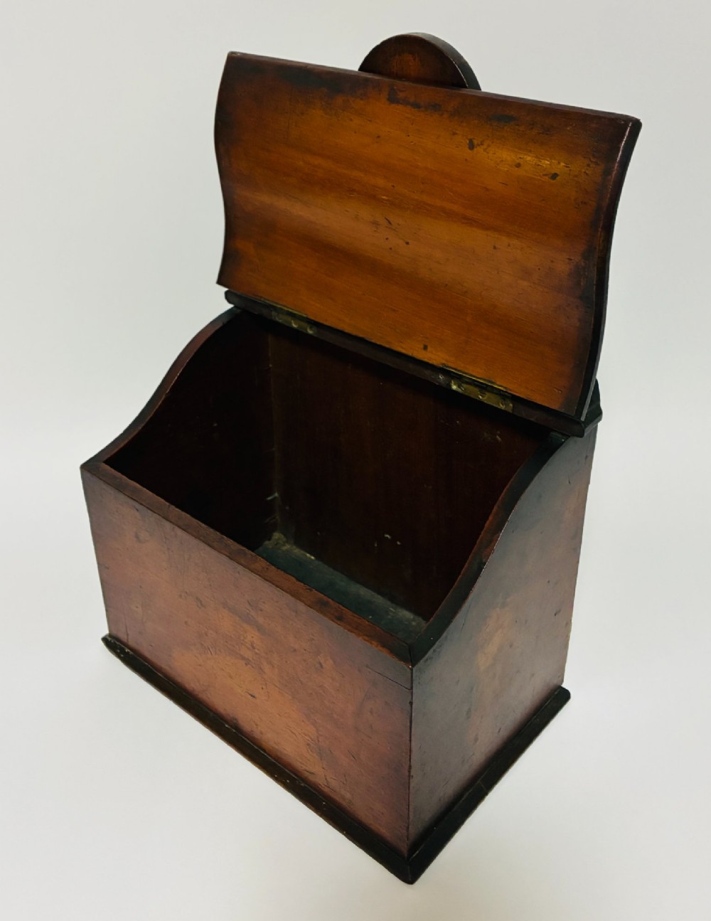 A dark mahogany Georgian hanging salt box with a curved hinged lid and a shaped backplate featuring a circular hanging hole. View IV