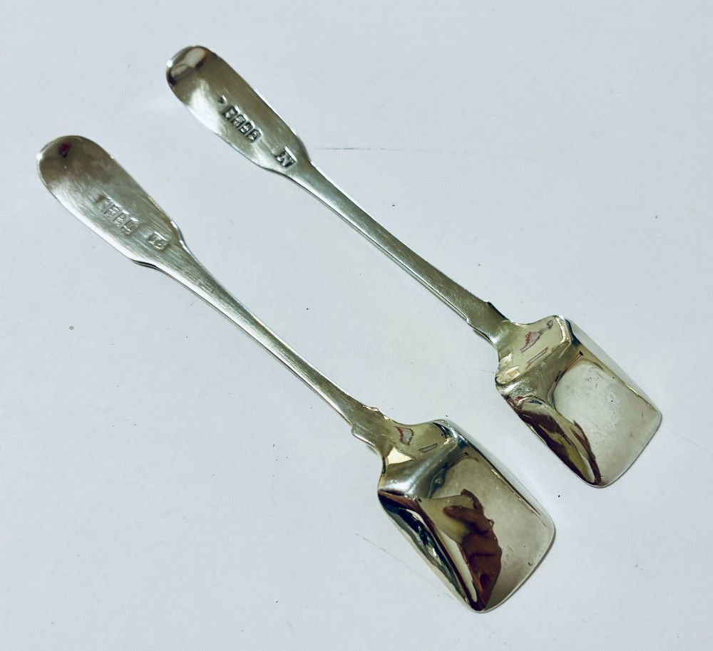 A pair of Georgian silver salt shovels featuring rectangular silver-gilt shovel bowls and smooth fiddle pattern handles. View VII