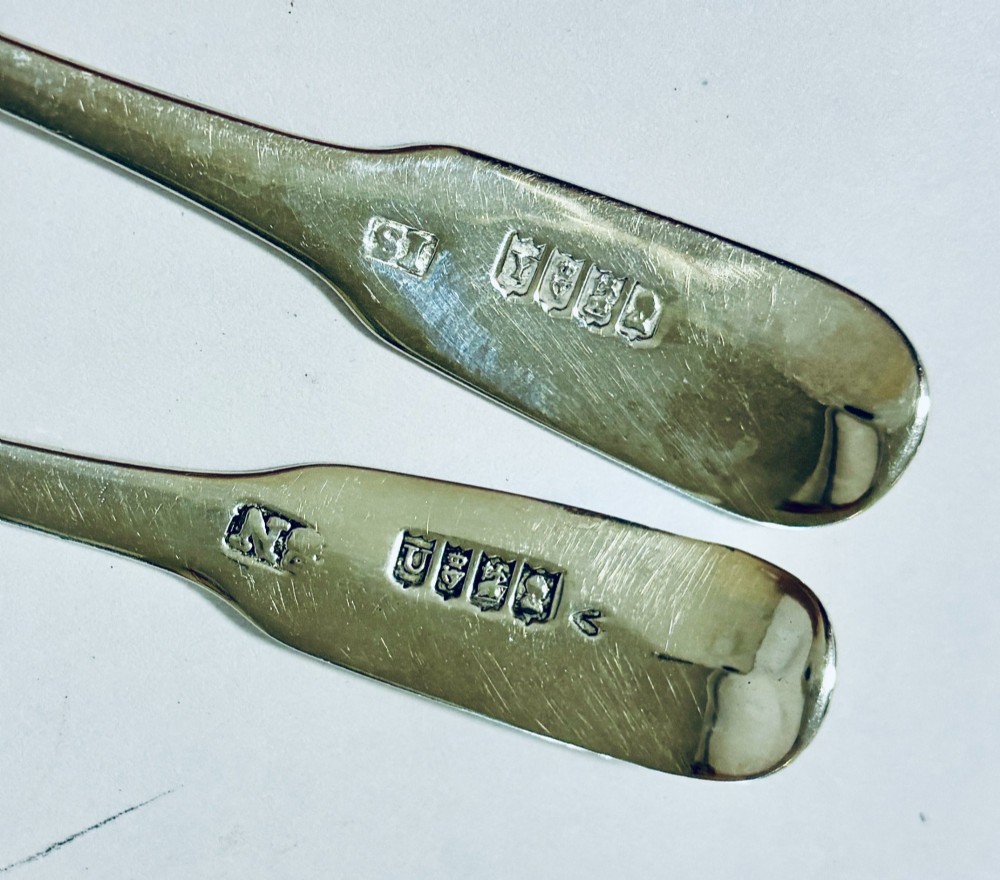 A pair of Georgian silver salt shovels featuring rectangular silver-gilt shovel bowls and smooth fiddle pattern handles. View VIII