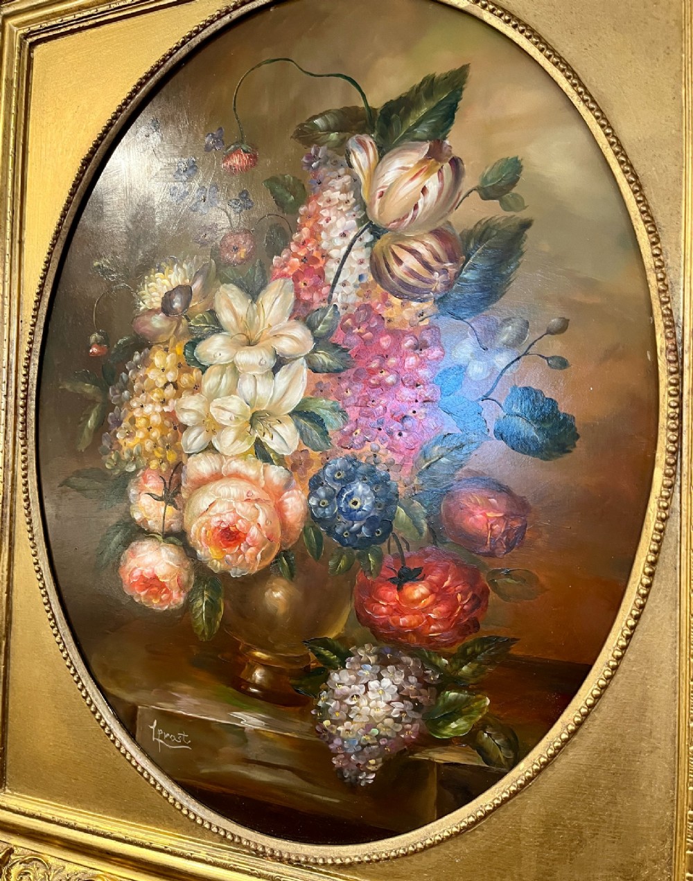 A pair of oil paintings on board featuring floral bouquets framed within oval apertures inside ornate gold frames. View VIII