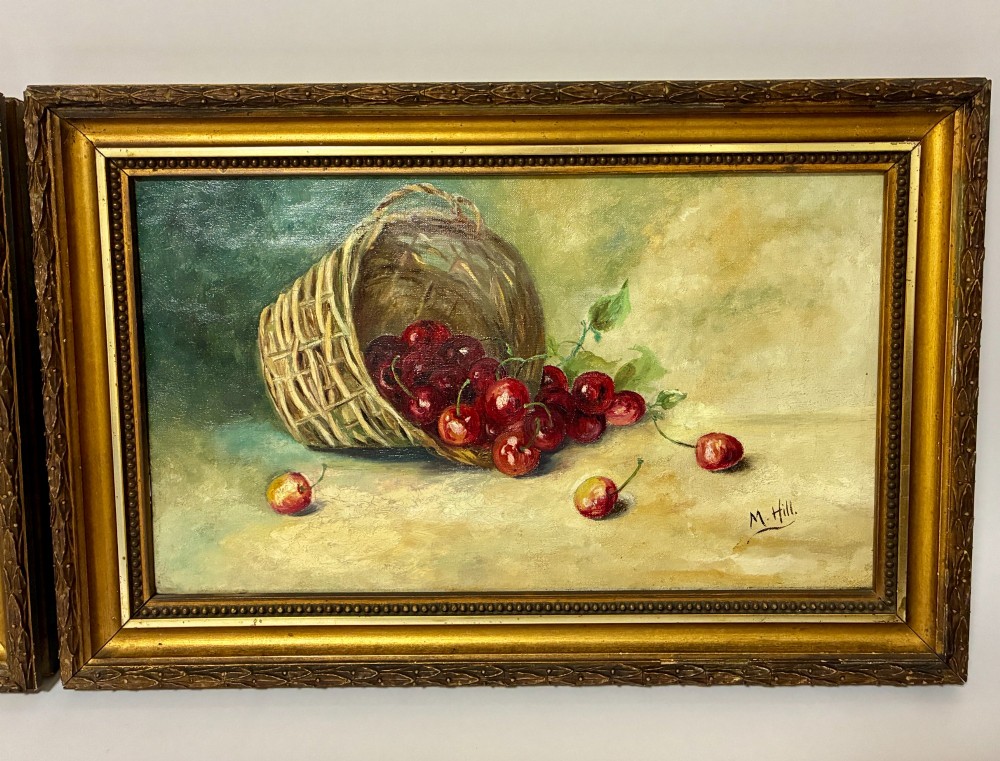 A pair of rectangular oil paintings depicting plums and cherries spilling from woven baskets in gilt wood frames. View II