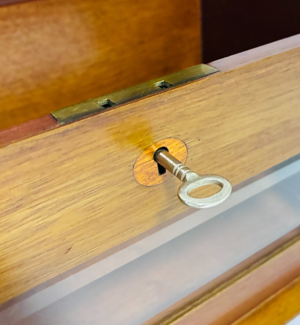 An antique mahogany tabletop letter box featuring a top posting slot, carved LETTERS plaque, key lock mechanism, and bevelled glass front panel. View IV