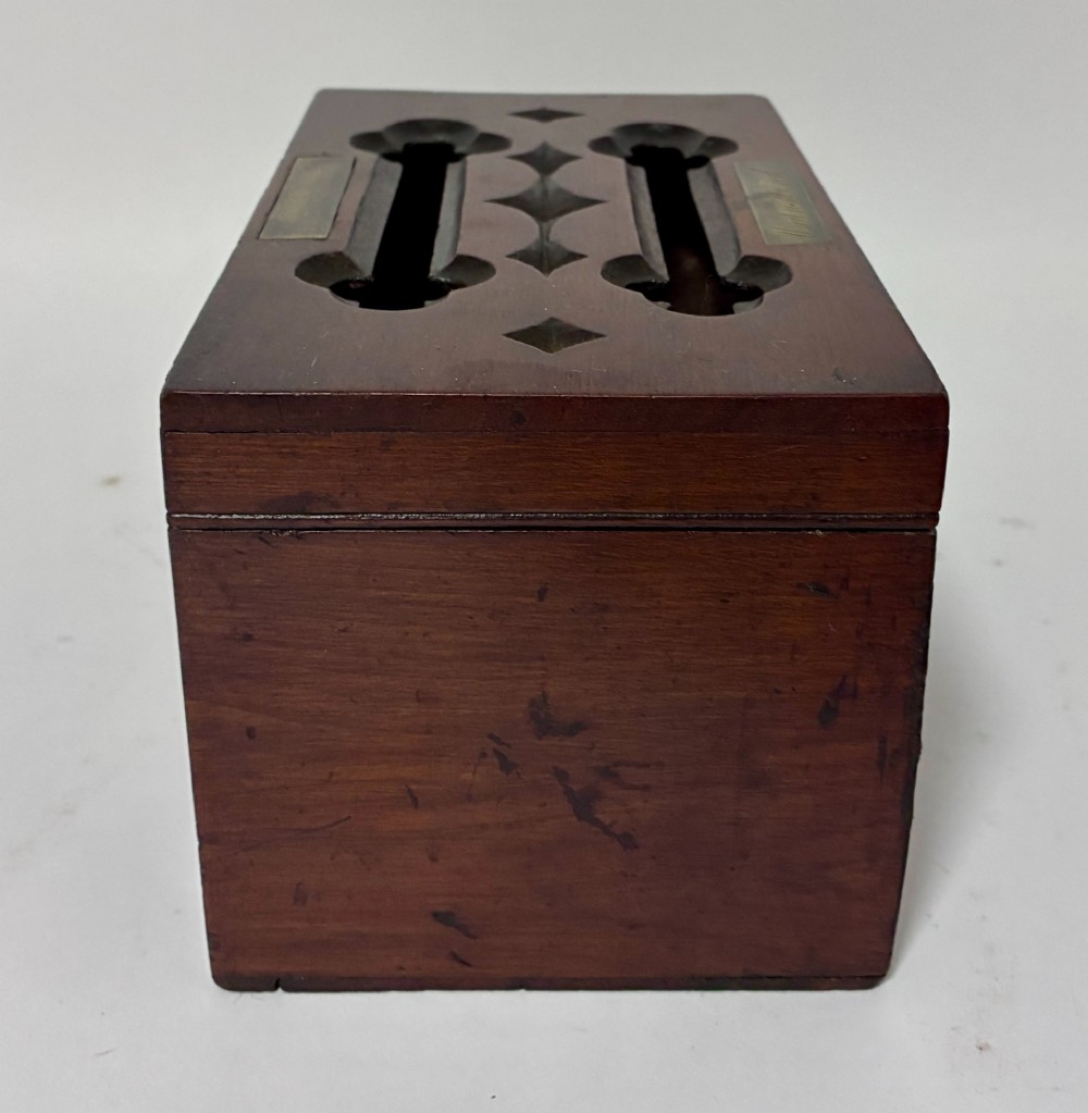 A rectangular dark wood correspondence box with Gothic Revival carved quatrefoil cut-outs backed in blue fabric and brass plates on top marked Answered and Unanswered. View VI