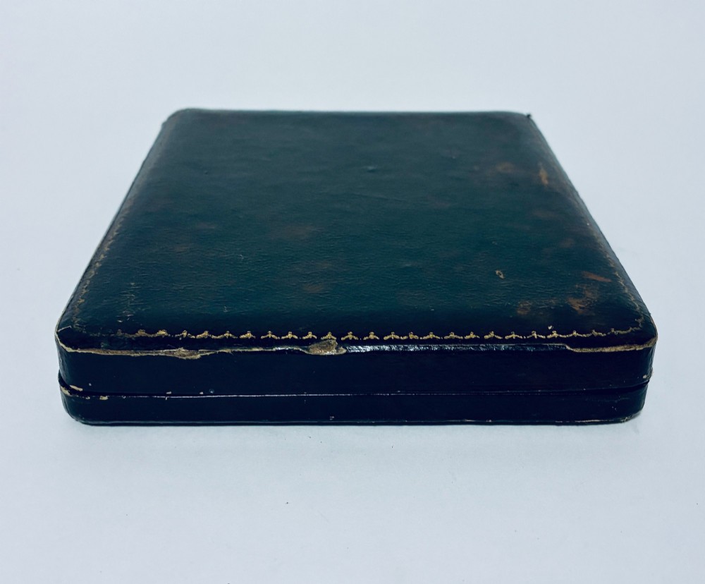 A set of six silver coffee spoons with turned handles stored inside a black fitted presentation case lined with velvet and cream satin. View XIII