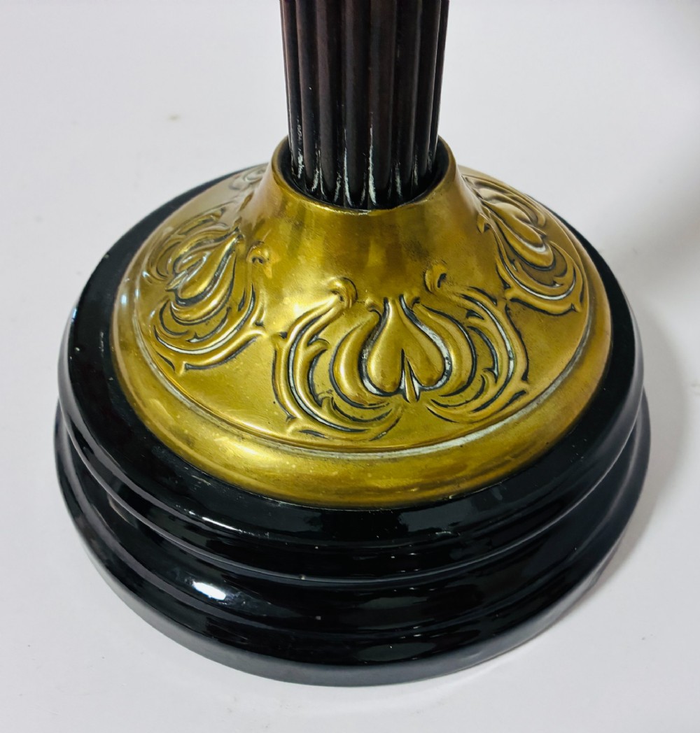A Victorian oil lamp featuring an etched frosted glass shade, a turquoise enamelled font, and a brass column on a dark stepped base. View IV