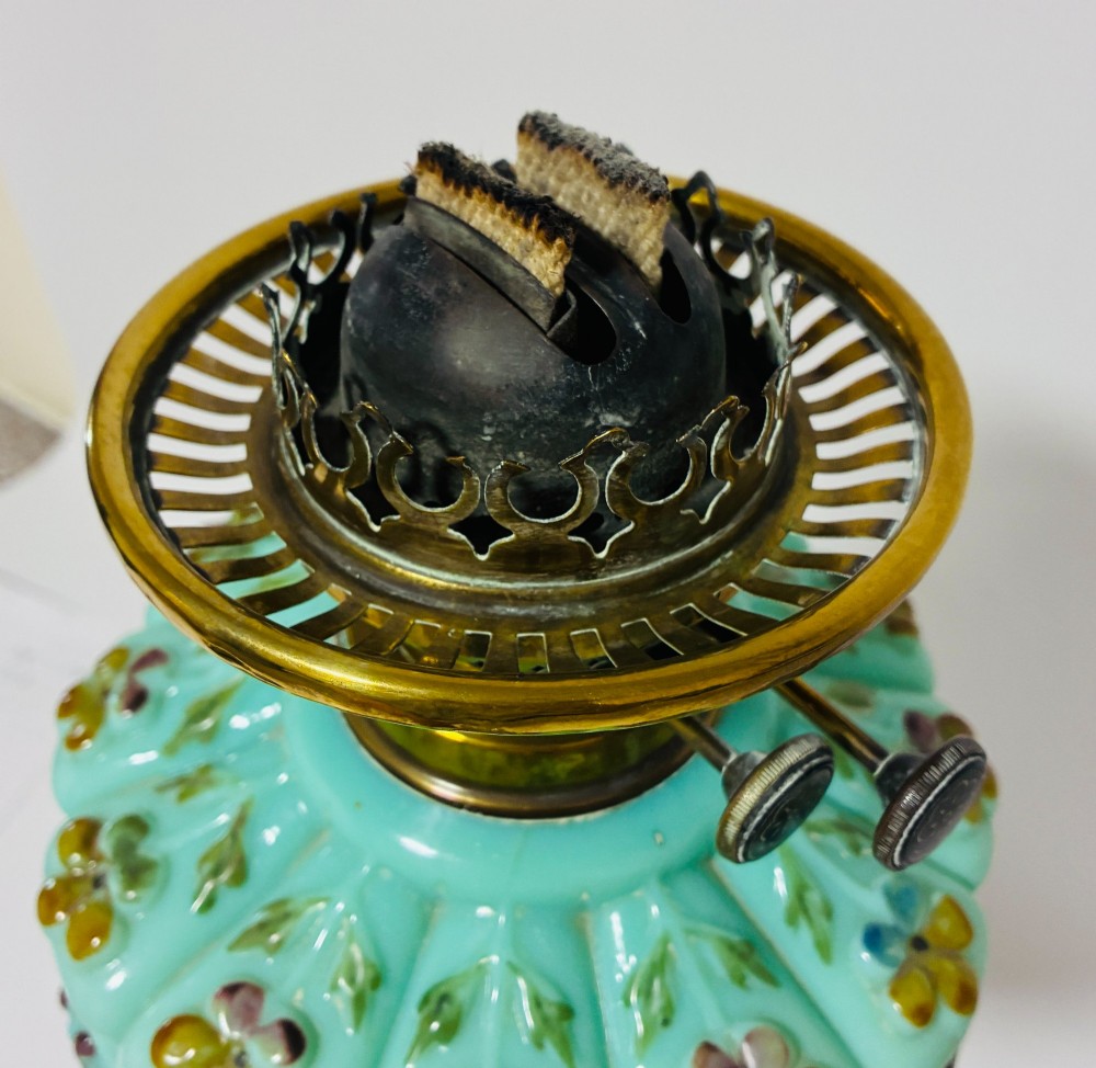 A Victorian oil lamp featuring an etched frosted glass shade, a turquoise enamelled font, and a brass column on a dark stepped base. View X