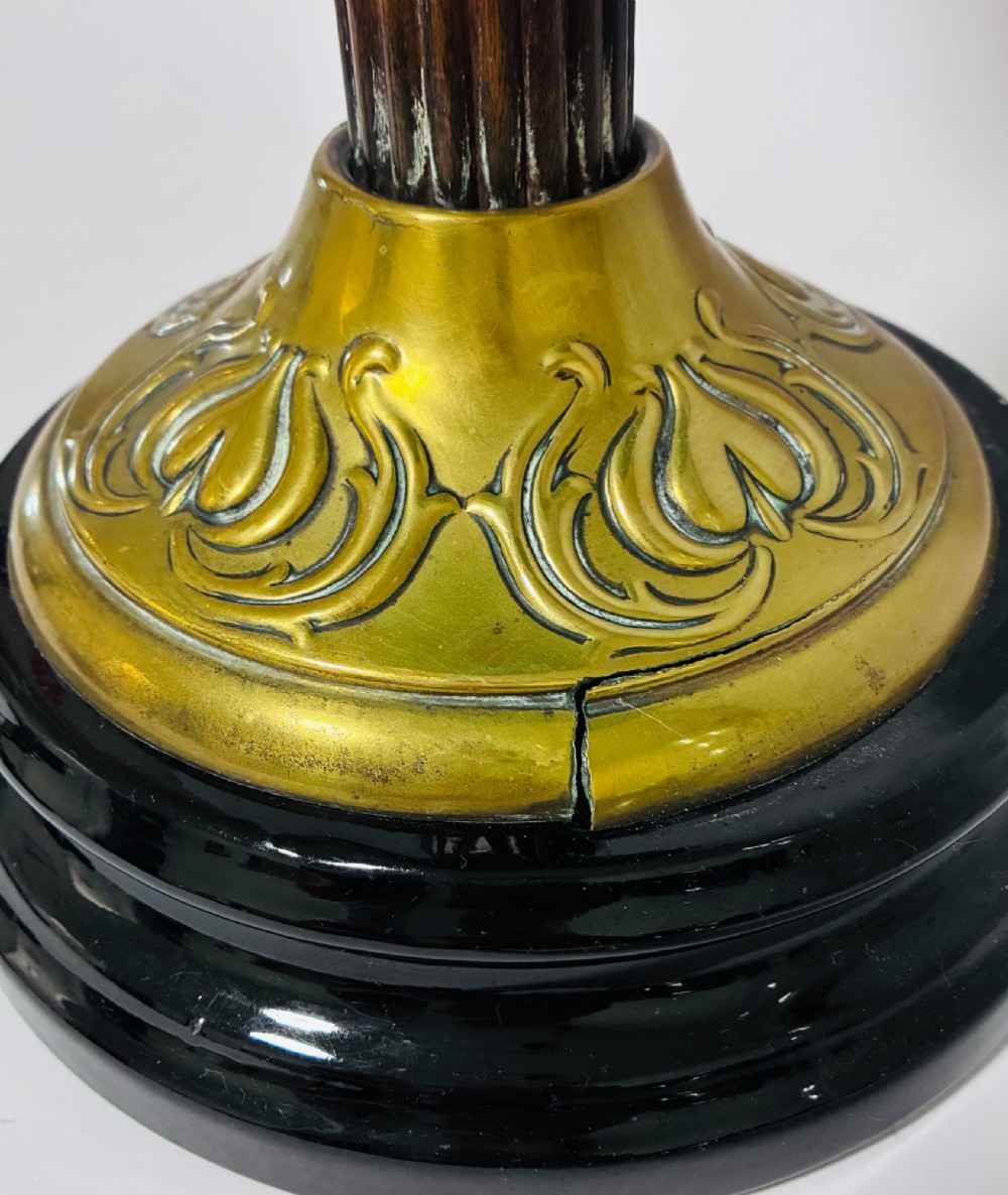 A Victorian oil lamp featuring an etched frosted glass shade, a turquoise enamelled font, and a brass column on a dark stepped base. View XII