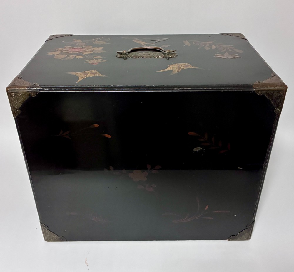 An antique Japanese black lacquer table cabinet decorated with gold bird and landscape scenes, fitted with metal corner brackets and a top handle. View XII