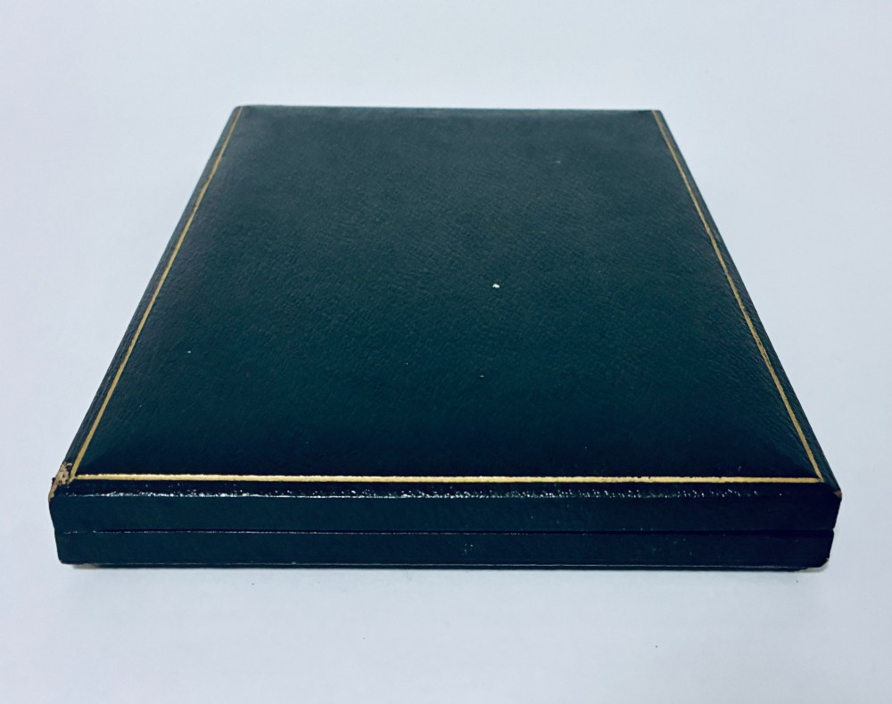 A cased set of six silver-handled butter knives with rounded blades displayed in a dark velvet-lined presentation box. View XI
