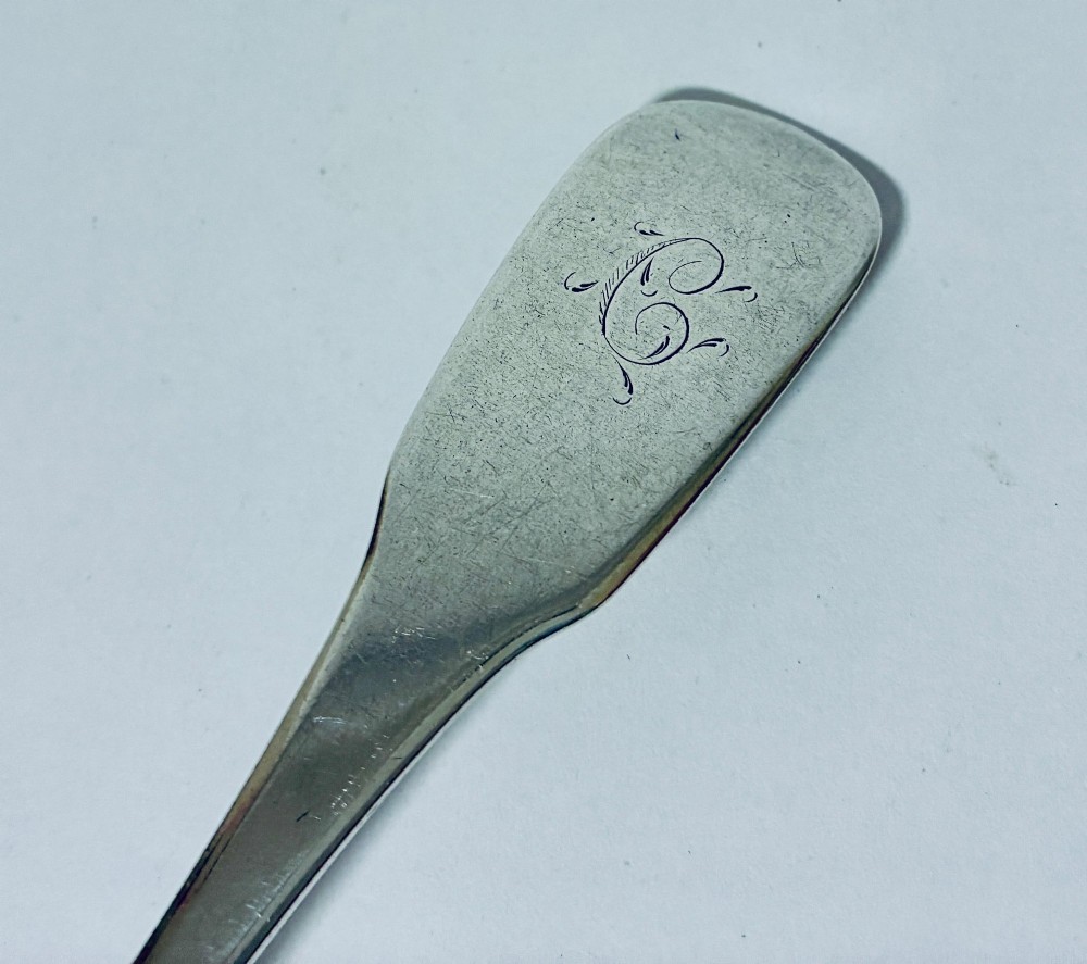 An antique Exeter sterling silver tablespoon featuring a classic fiddle pattern handle with an engraved monogram. View III