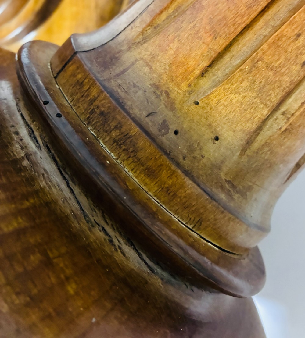 A pair of turned oak Neoclassical display pedestals featuring fluted columns and circular molded tops. View IX