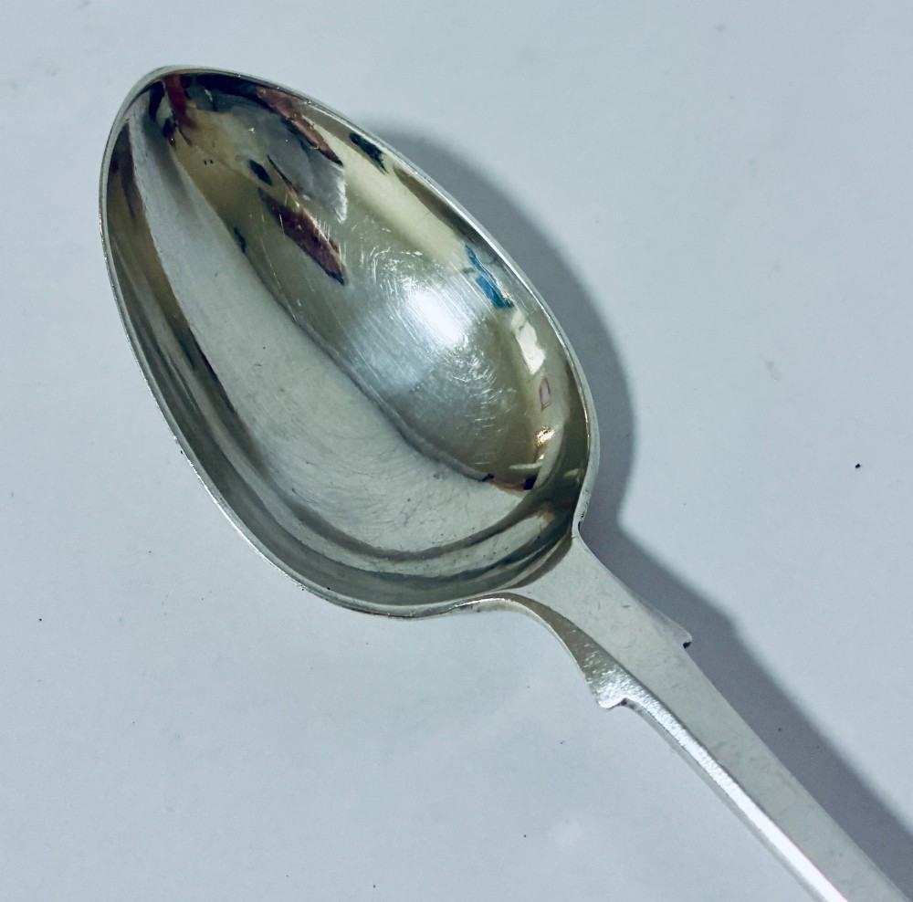 A sterling silver fiddle pattern tablespoon featuring an engraved monogram on the handle terminal and a polished oval bowl. View III