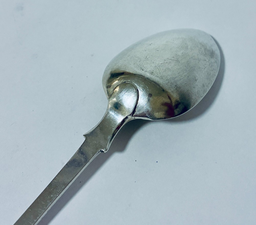 A sterling silver fiddle pattern tablespoon featuring an engraved monogram on the handle terminal and a polished oval bowl. View VIII