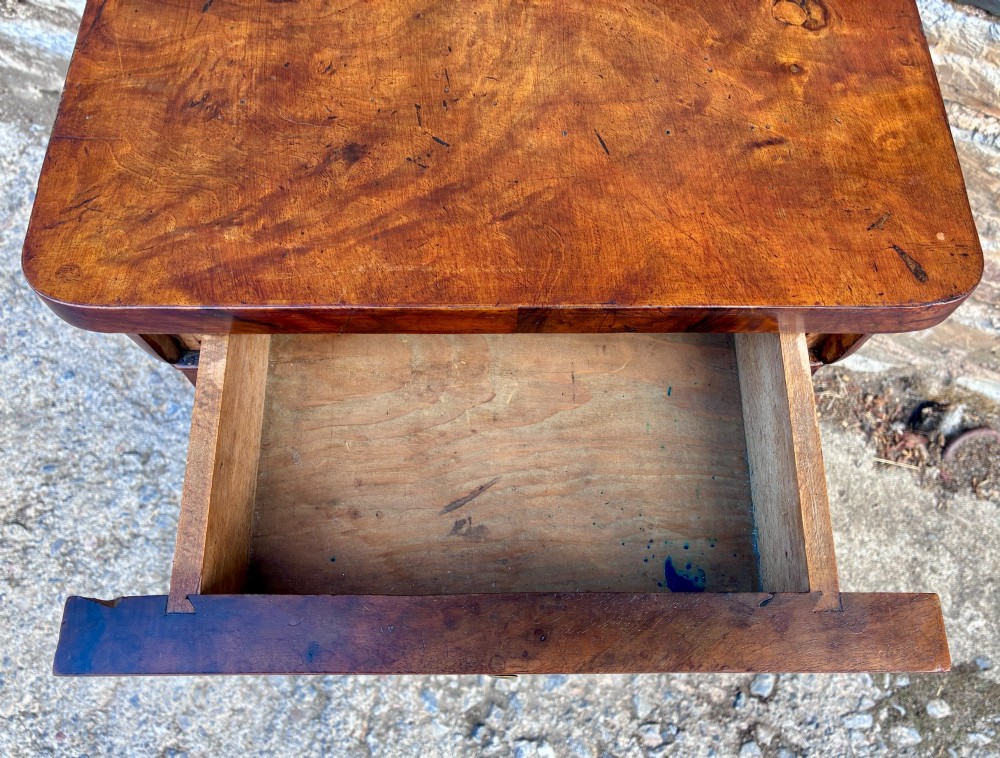 An antique French walnut pot cupboard with a figured burr walnut door panel, frieze drawer, and plinth base. View XII