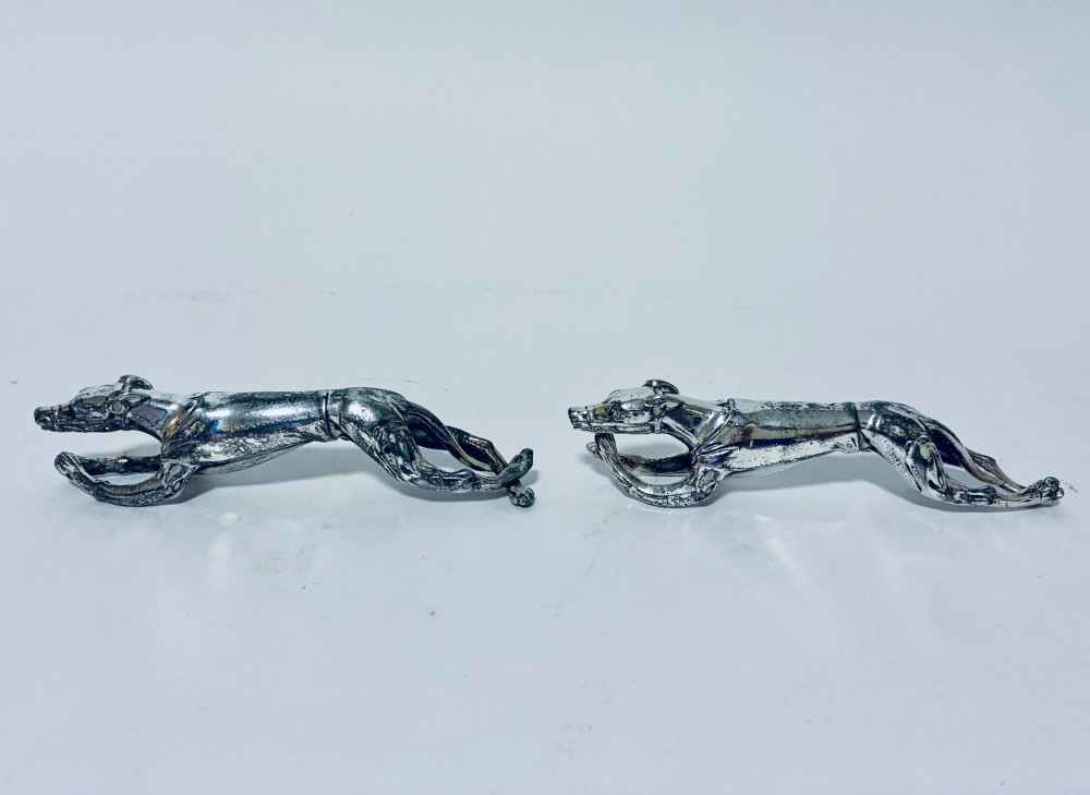 A pair of silver-plated knife rests sculpted in the form of running greyhounds with outstretched legs. View II