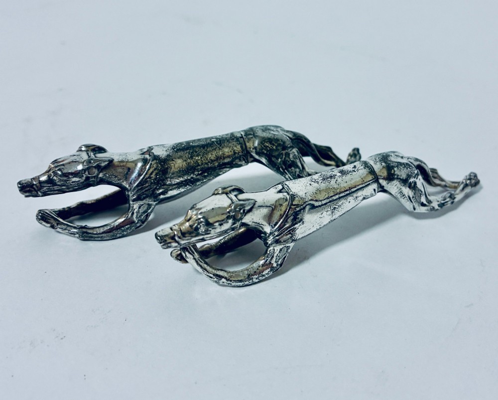 A pair of silver-plated knife rests sculpted in the form of running greyhounds with outstretched legs. View IV