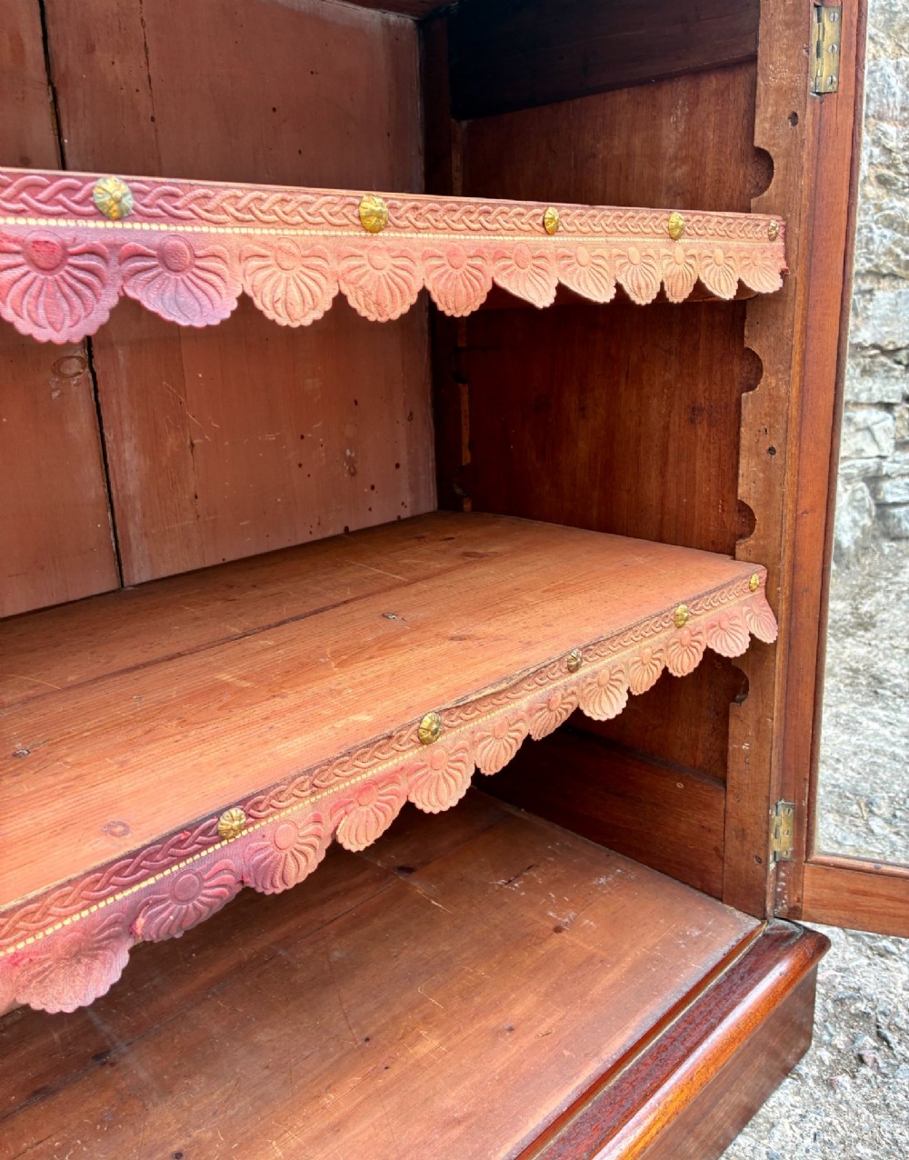 A tall Victorian mahogany cabinet featuring an upper two-door glazed section with scalloped shelf edging set above a lower matching glazed cupboard. View XIV