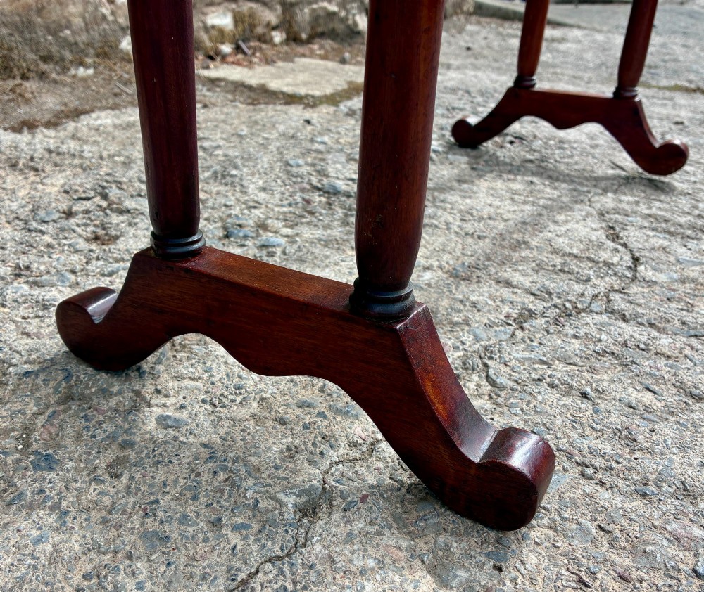 A freestanding Victorian mahogany towel rail featuring arched top cresting, turned upright supports, four horizontal bars, and shaped trestle feet. View VII