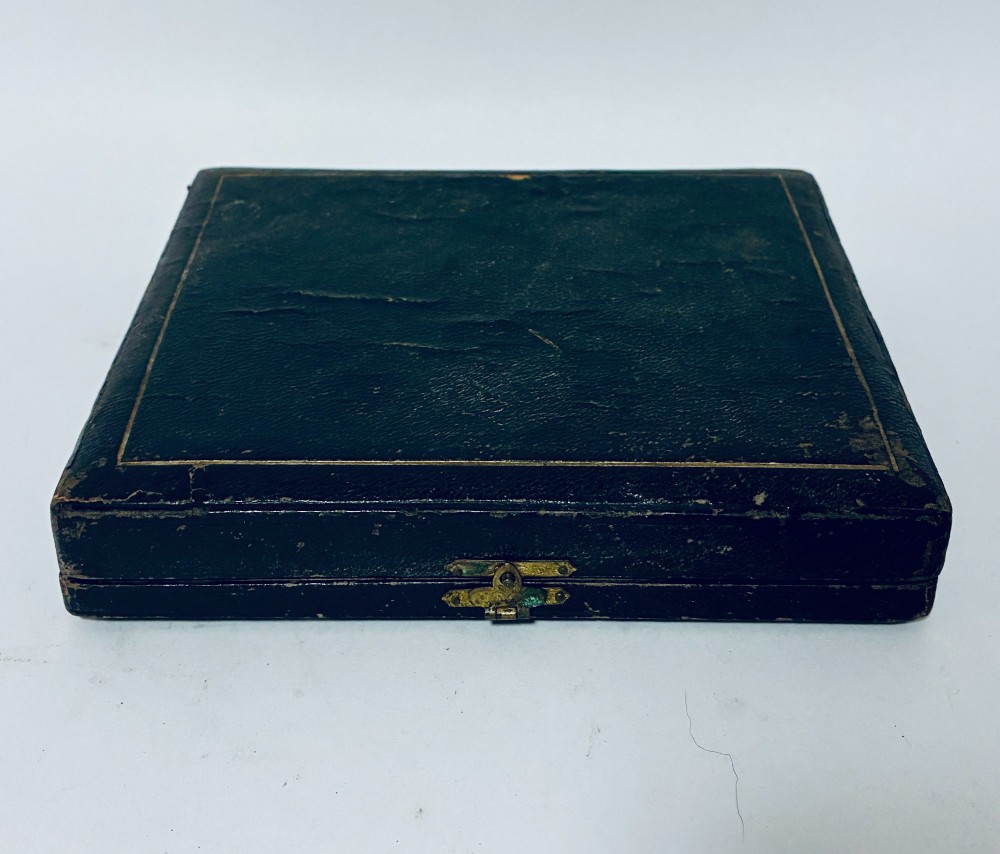 A cased set of four Victorian shell-shaped silver salt cellars with gilded interiors and two matching silver spoons in a velvet-lined box. View VIII