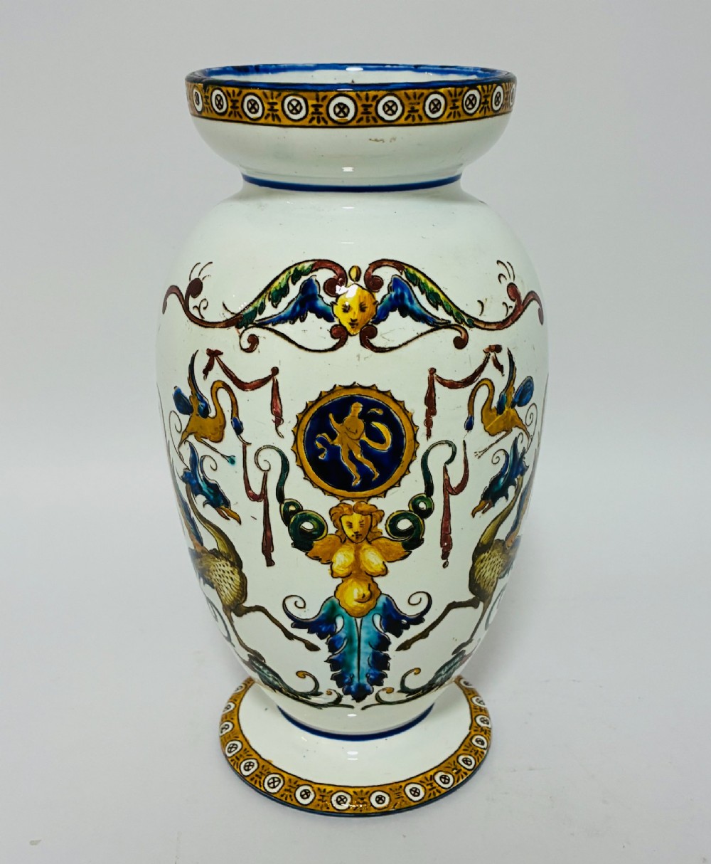 An antique Gien French faience ceramic vase decorated with hand-painted Renaissance grotesque motifs on a white glazed earthenware background.