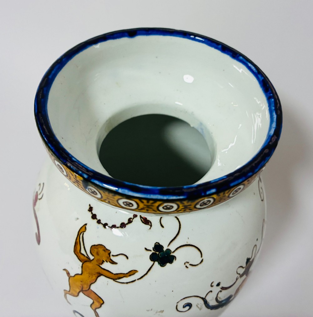 An antique Gien French faience ceramic vase decorated with hand-painted Renaissance grotesque motifs on a white glazed earthenware background. View V