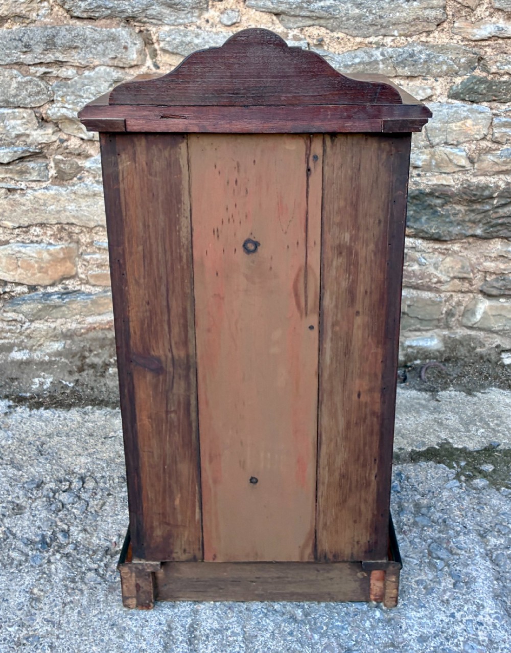 A Victorian burr walnut pot cupboard featuring a single door with ebonised moulding, a rounded top edge, shaped splashback gallery, and dark wooden knob. View VIII