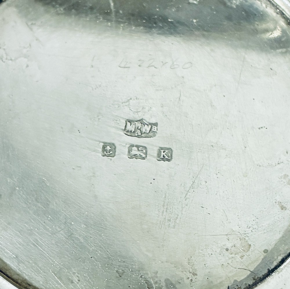 A square Art Deco silver powder compact with an engine-turned guilloche surface and a stepped geometric motif. View IV