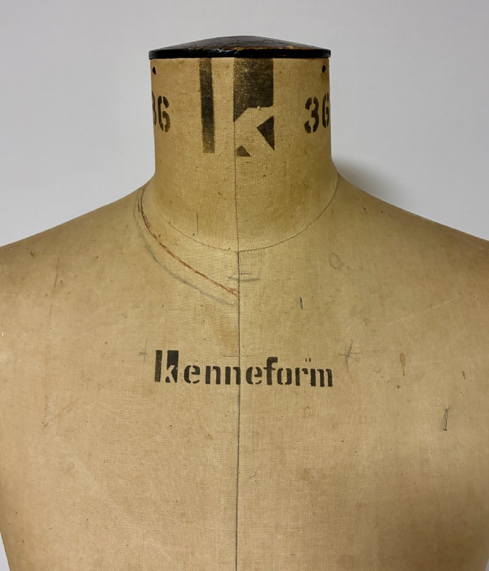 A vintage fabric-covered dressmakers mannequin torso displaying the Kenneform and Kennett and Lindsell maker marks. View III