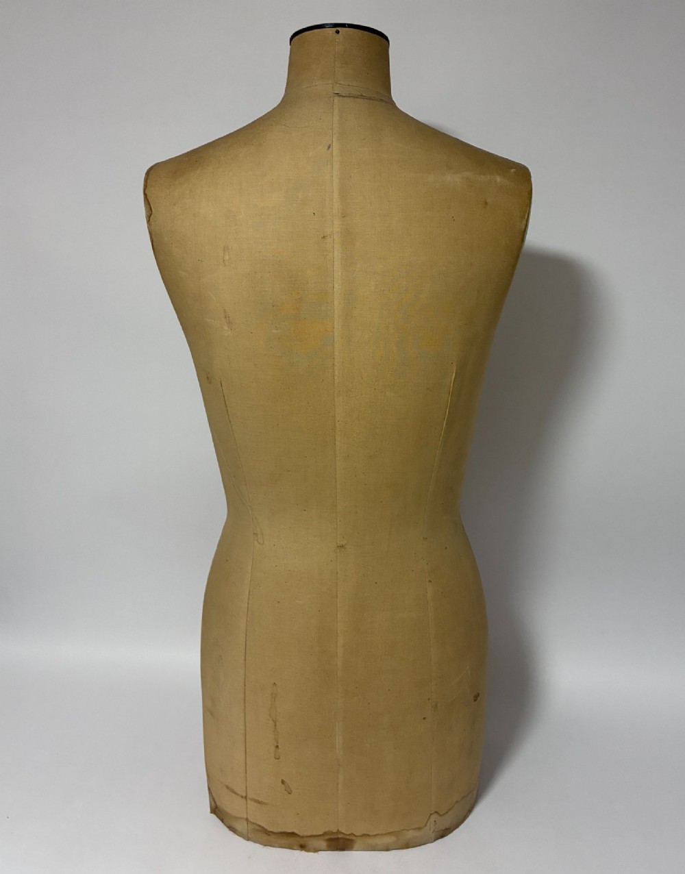 A vintage fabric-covered dressmakers mannequin torso displaying the Kenneform and Kennett and Lindsell maker marks. View VI