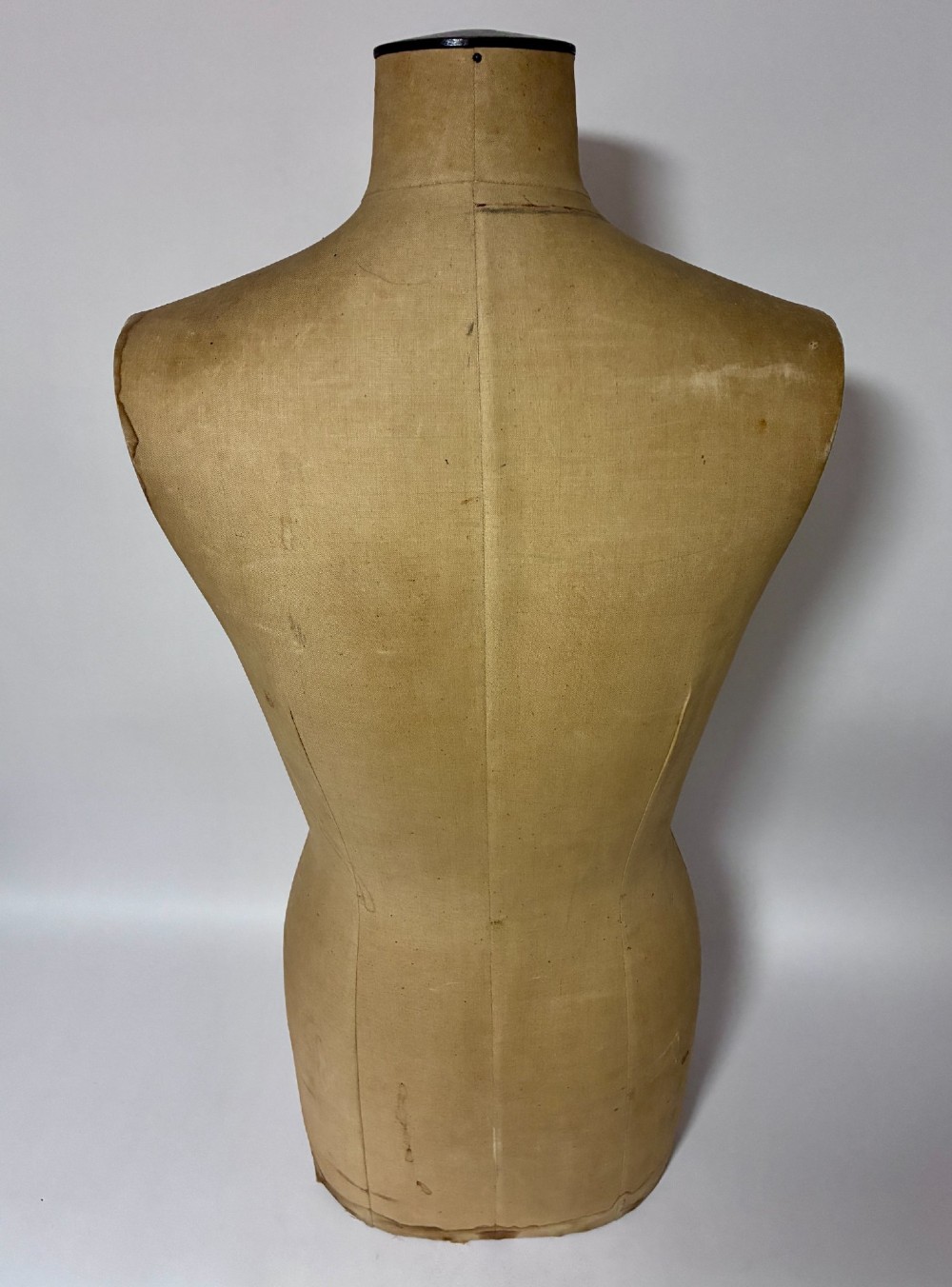A vintage fabric-covered dressmakers mannequin torso displaying the Kenneform and Kennett and Lindsell maker marks. View VII