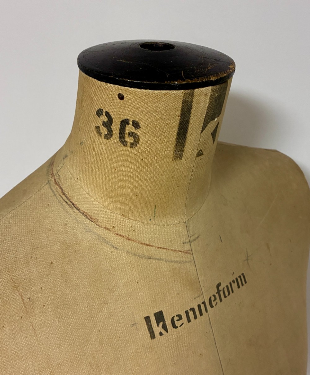 A vintage fabric-covered dressmakers mannequin torso displaying the Kenneform and Kennett and Lindsell maker marks. View XI
