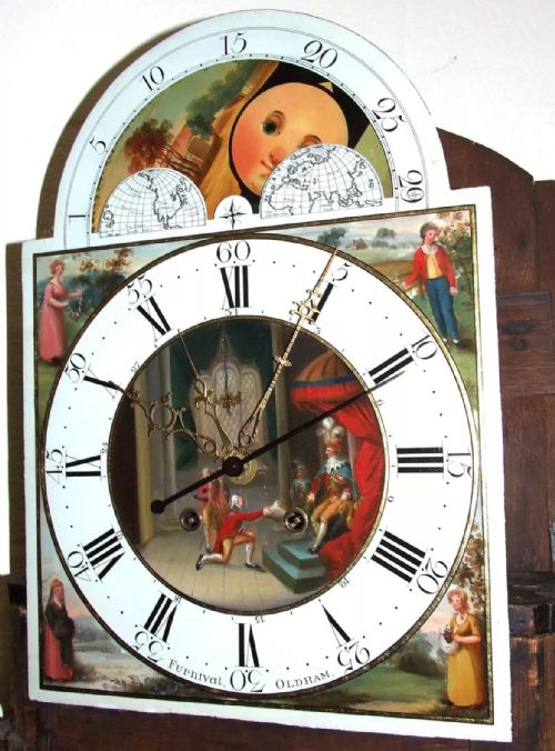 fig 3. An antique mahogany longcase grandfather clock featuring a painted arched dial with a moon phase indicator, swan neck pediment, and flame mahogany inlaid cabinet door.