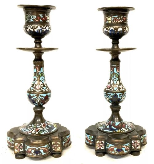fig 9. A three-piece French late nineteenth-century cloisonne enamel clock garniture set featuring a central arched mantel clock with turned side columns flanked by a pair of matching enamelled candlesticks.