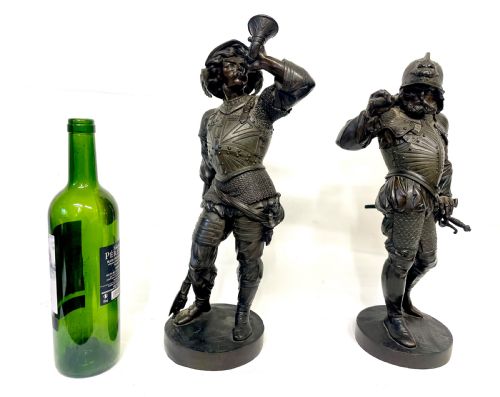 fig 2. A pair of dark patinated Victorian bronze figures depicting armoured cavalier soldiers standing on circular bases.