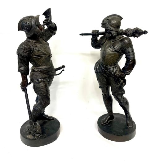 fig 3. A pair of dark patinated Victorian bronze figures depicting armoured cavalier soldiers standing on circular bases.
