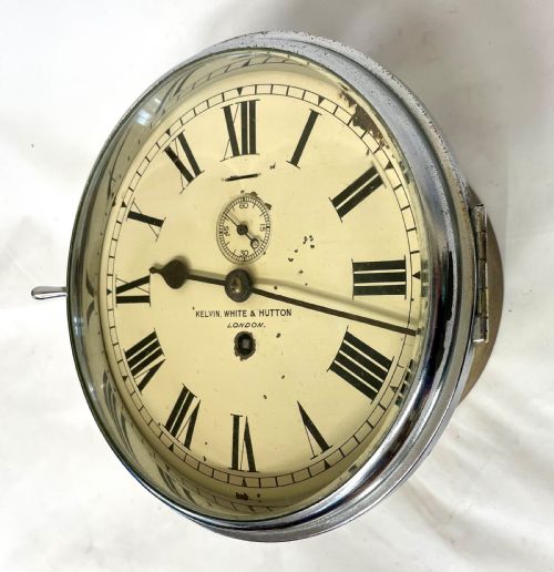 fig 2. An antique circular nickel-plated brass ships bulkhead clock featuring a cream dial with Roman numerals and a subsidiary seconds dial.