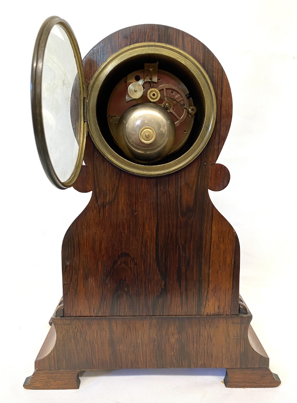 An antique French rosewood mantel clock featuring detailed brass foliage marquetry, bone cherub inlay, and a circular Roman numeral dial. View IX