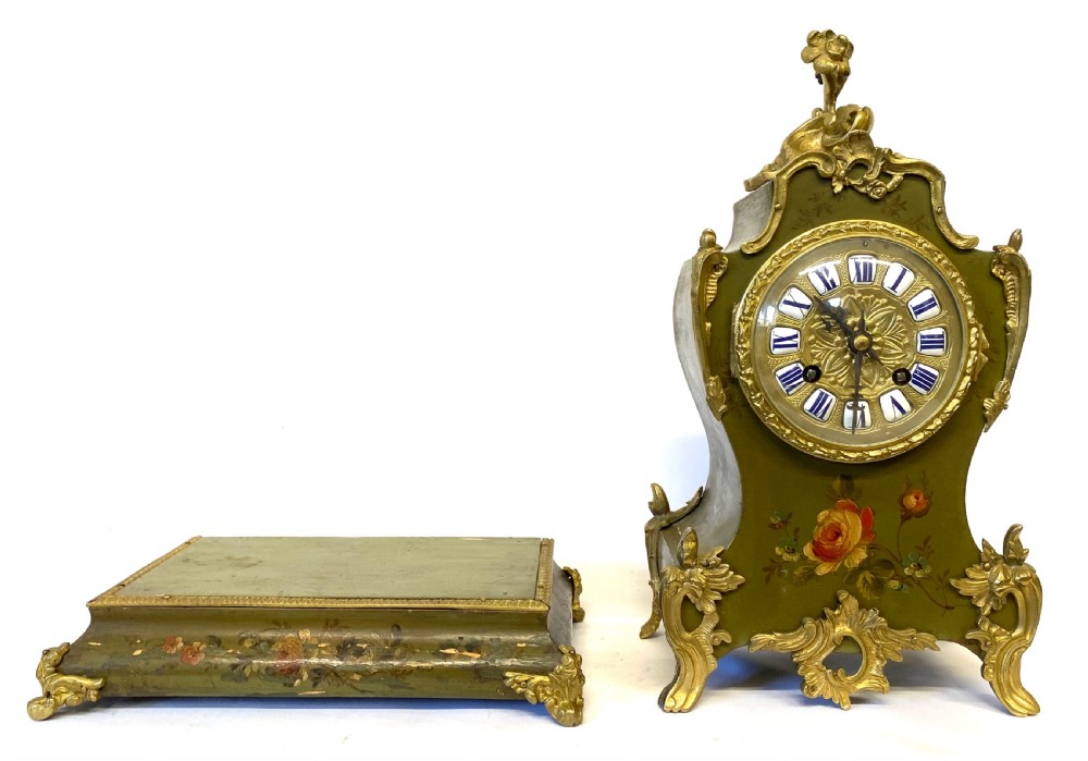 An olive green hand-painted French mantel clock set on a matching plinth stand with gilded bronze ormolu mounts, floral motifs, and a central circular dial with enamel Roman numeral markers. View XI
