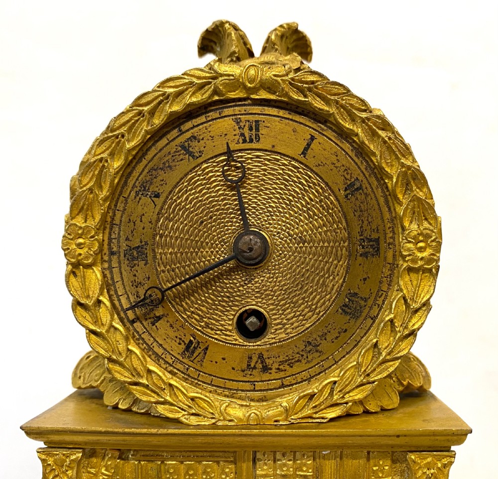 Stunning Antique Regency Gilt Bronze Clock Depicting A Bookshelf Silk Suspension View III