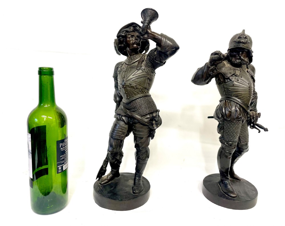 A pair of dark patinated Victorian bronze figures depicting armoured cavalier soldiers standing on circular bases. View III