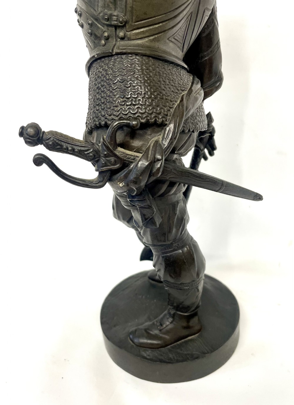 A pair of dark patinated Victorian bronze figures depicting armoured cavalier soldiers standing on circular bases. View XII