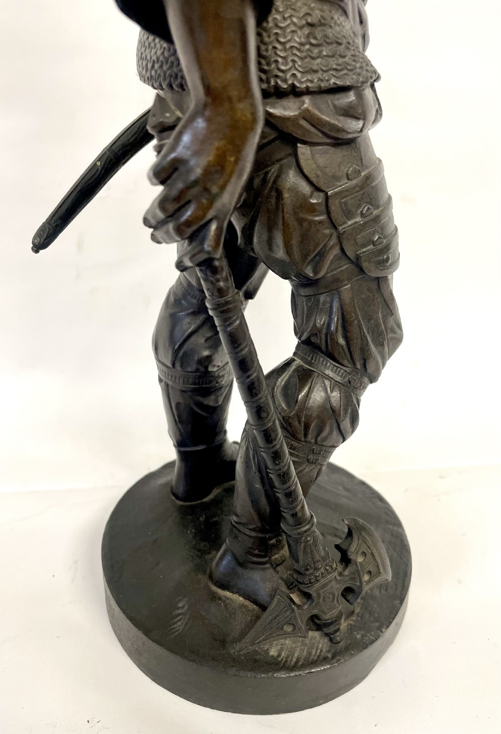 A pair of dark patinated Victorian bronze figures depicting armoured cavalier soldiers standing on circular bases. View XIV