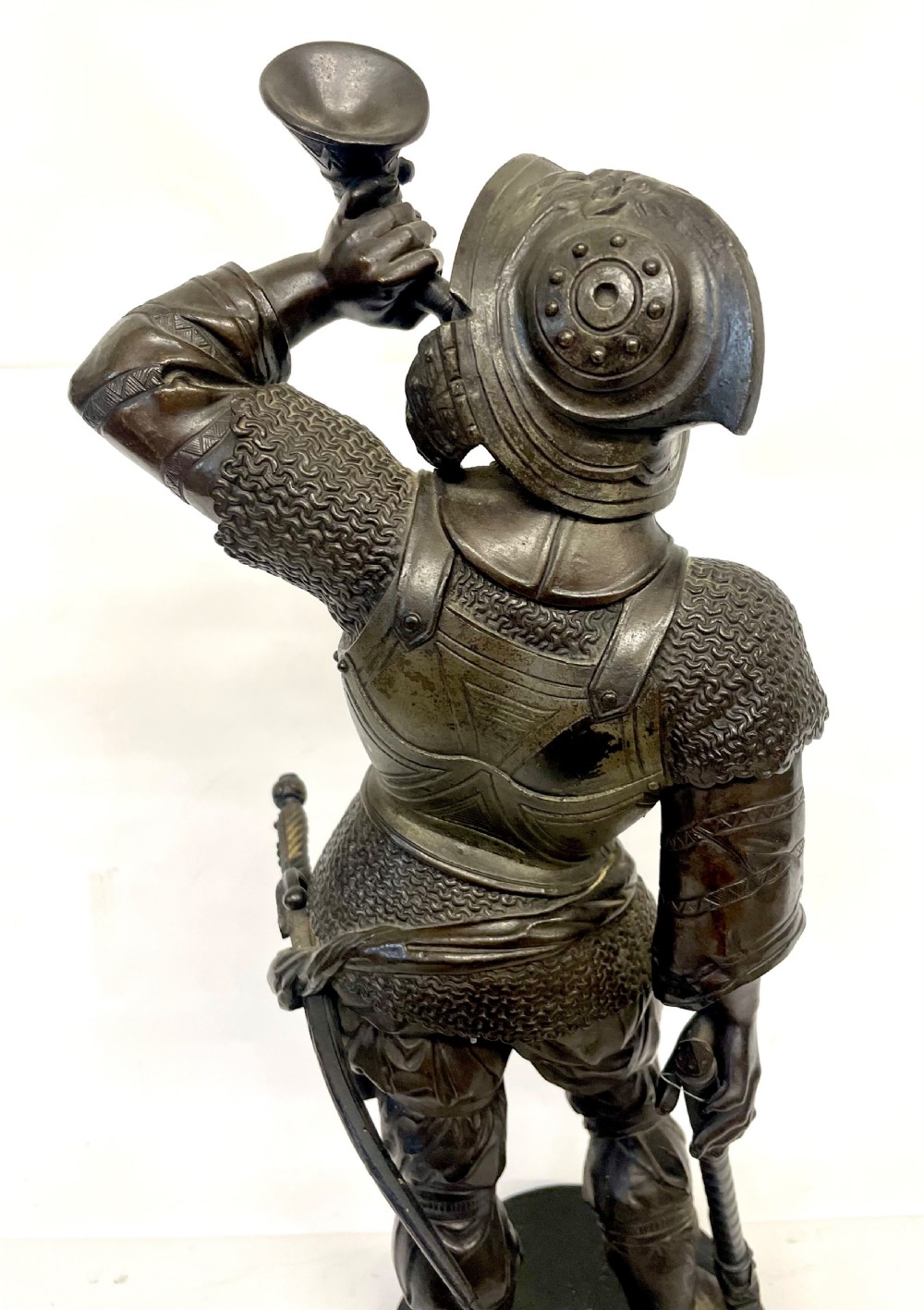 A pair of dark patinated Victorian bronze figures depicting armoured cavalier soldiers standing on circular bases. View XV