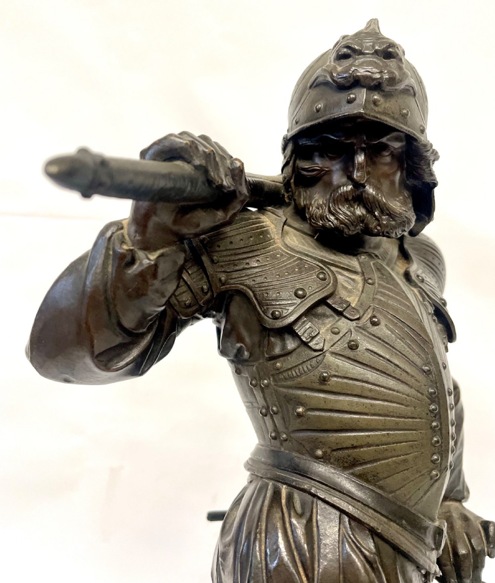 A pair of dark patinated Victorian bronze figures depicting armoured cavalier soldiers standing on circular bases. View XVI