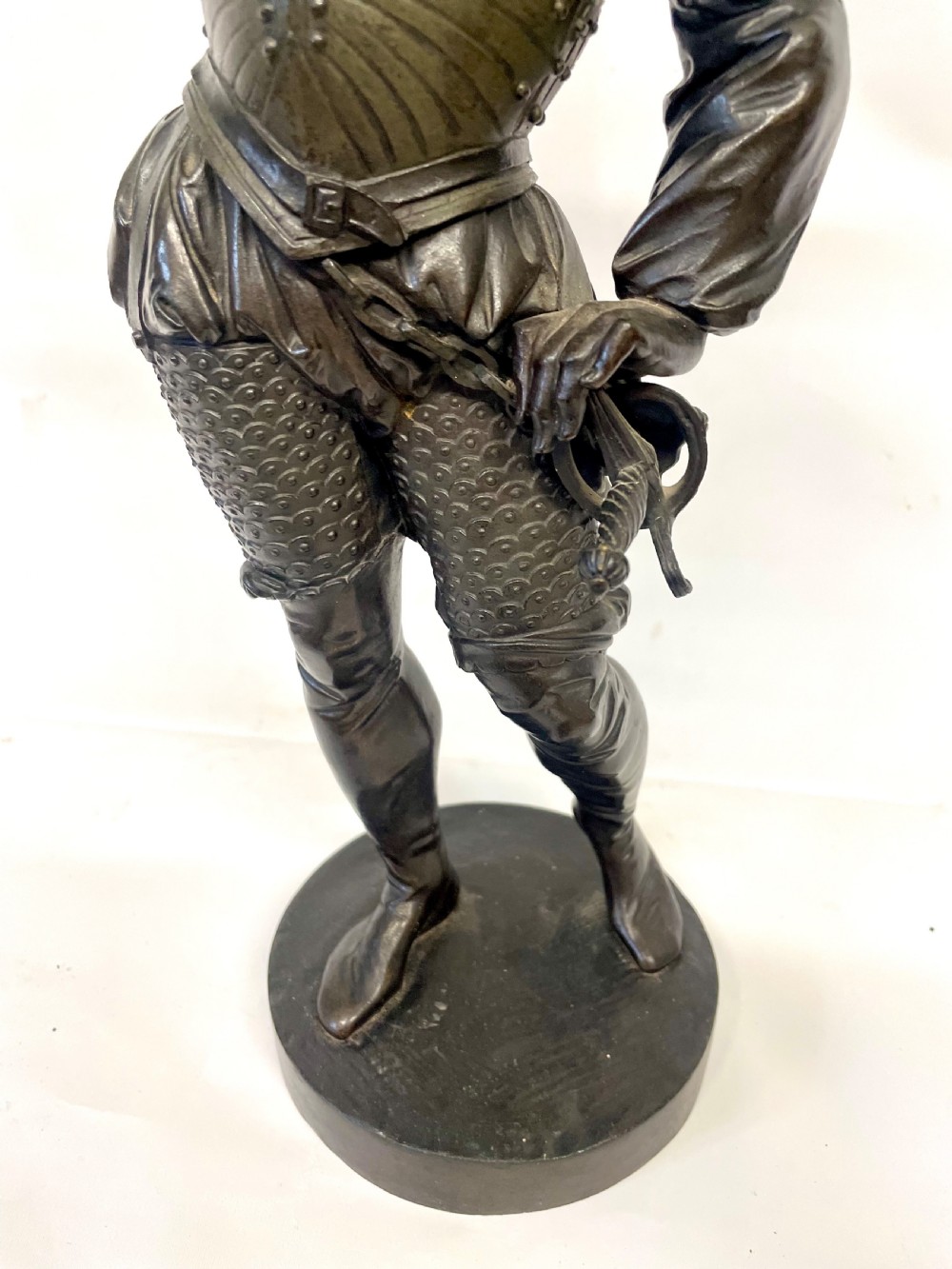 A pair of dark patinated Victorian bronze figures depicting armoured cavalier soldiers standing on circular bases. View XIX