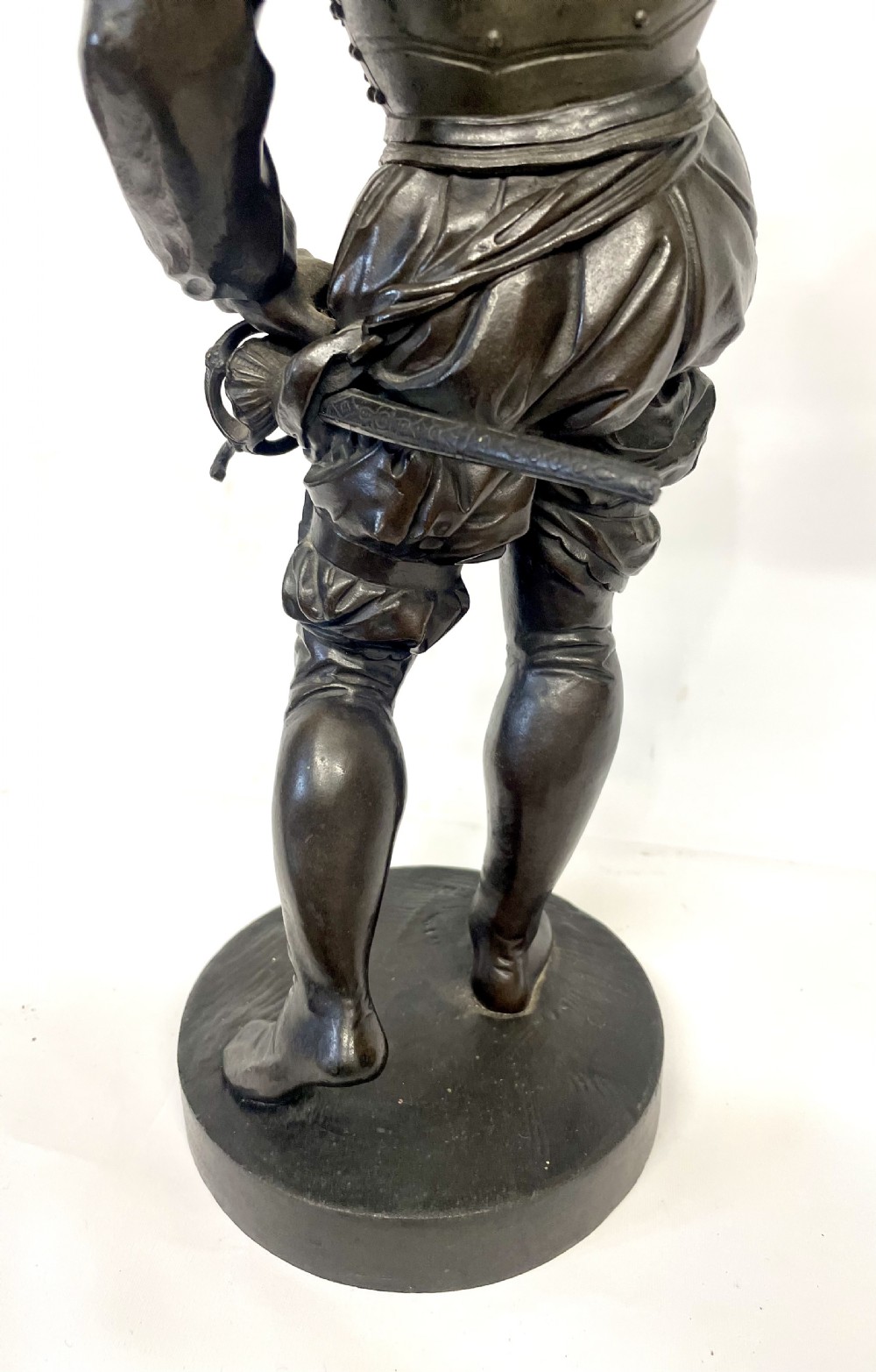 A pair of dark patinated Victorian bronze figures depicting armoured cavalier soldiers standing on circular bases. View XXI